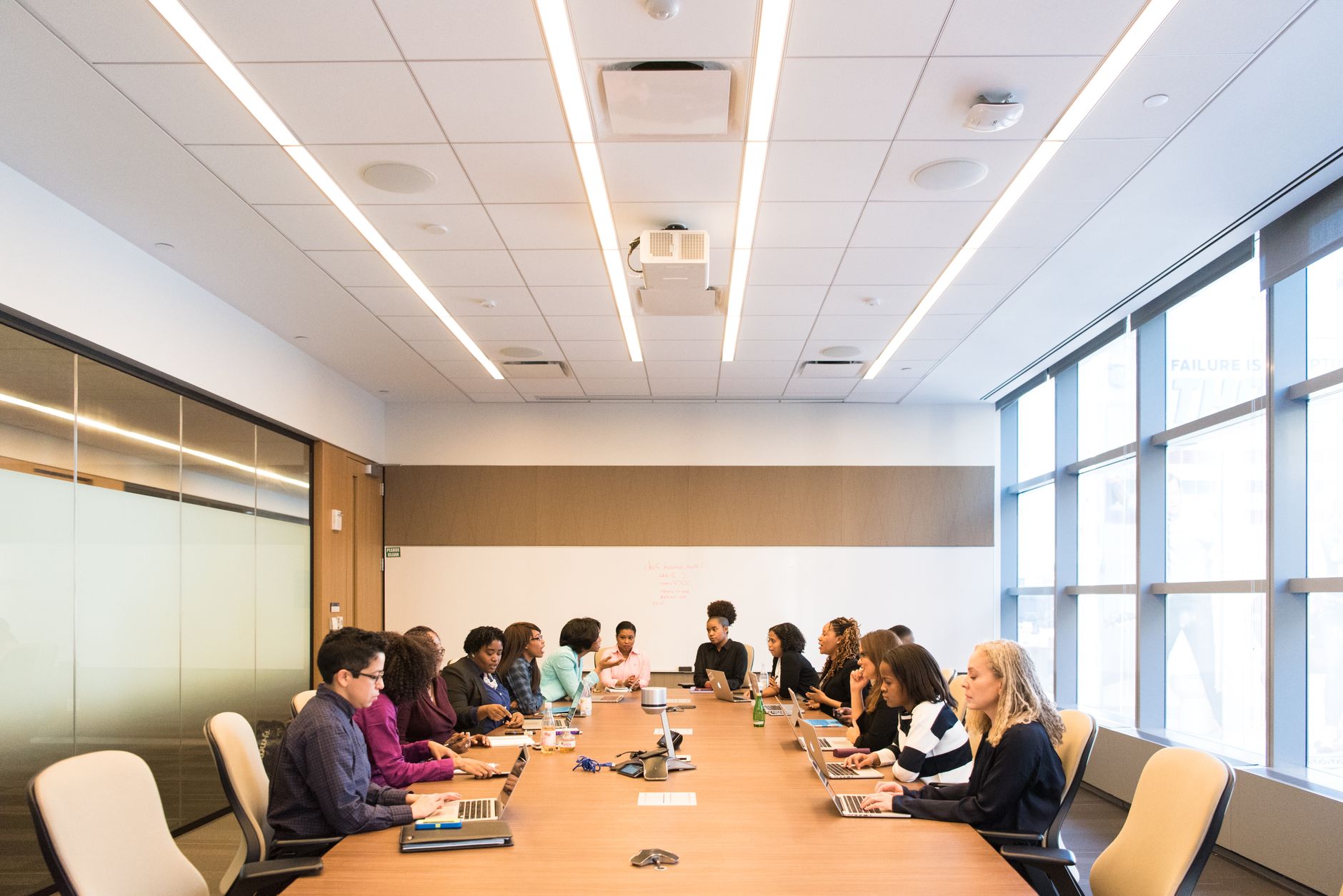 Editorial team collaborating in meeting room